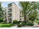 Beautiful exterior view of condo building featuring balconies, landscaping and reserved parking at 7780 W 38Th Ave # 203, Wheat Ridge, CO 80033