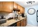 Kitchen featuring granite countertops, stainless steel appliances, updated lighting, and a sink at 7780 W 38Th Ave # 203, Wheat Ridge, CO 80033