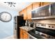Kitchen view of stainless steel appliances, granite countertops, and tile backsplash at 7780 W 38Th Ave # 203, Wheat Ridge, CO 80033