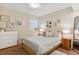 A cozy bedroom features a neutral color palette and plenty of natural light at 327 Ingleton Ct, Castle Pines, CO 80108