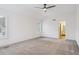 Bedroom with neutral carpet, light walls, and access to ensuite bathroom at 327 Ingleton Ct, Castle Pines, CO 80108