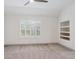 Carpeted bedroom with window and a built-in shelving unit at 327 Ingleton Ct, Castle Pines, CO 80108