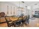 Bright dining room with modern light fixture, wood table, and decorative oars at 327 Ingleton Ct, Castle Pines, CO 80108