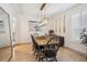 Dining room with wood table, chairs, overhead lighting, and beach-themed decor at 327 Ingleton Ct, Castle Pines, CO 80108