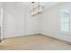 Empty dining room with light-colored wood floors and natural light at 327 Ingleton Ct, Castle Pines, CO 80108