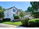 Charming two-story home with well-maintained landscaping and a stone-accented garden bed at 327 Ingleton Ct, Castle Pines, CO 80108