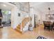 Grand entryway with wood floors, staircase, dining area and stylish decor at 327 Ingleton Ct, Castle Pines, CO 80108
