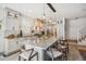 Spacious kitchen featuring a large island with seating and modern white cabinetry at 327 Ingleton Ct, Castle Pines, CO 80108