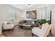 Comfortable living room with stylish furniture and bright windows at 327 Ingleton Ct, Castle Pines, CO 80108