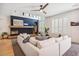 Cozy living room with a modern fireplace and large windows at 327 Ingleton Ct, Castle Pines, CO 80108
