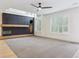 Open living room featuring a modern fireplace and bright windows at 327 Ingleton Ct, Castle Pines, CO 80108