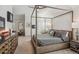 This bedroom features a beautiful bed frame, carpet floors, and neutral colored walls at 327 Ingleton Ct, Castle Pines, CO 80108