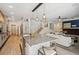 Open-concept kitchen flowing into the living room with a fireplace and plenty of seating at 327 Ingleton Ct, Castle Pines, CO 80108