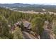 Aerial view of house, showcasing mountain views at 7845 Armadillo Trl, Evergreen, CO 80439