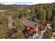 Aerial view of home and surrounding landscape at 7845 Armadillo Trl, Evergreen, CO 80439