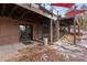 Back patio with double doors and a dog enclosure at 7845 Armadillo Trl, Evergreen, CO 80439