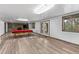 Basement featuring stone fireplace, laminate floors, walk out and space for a pool table at 7845 Armadillo Trl, Evergreen, CO 80439