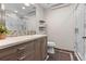 Bathroom with a modern vanity, granite counter, mosaic tile backsplash and walk in shower at 7845 Armadillo Trl, Evergreen, CO 80439