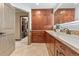 Bathroom featuring custom wood cabinets, granite countertops, and decorative tile backsplash at 7845 Armadillo Trl, Evergreen, CO 80439