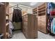 Walk-in closet with custom shelving and a central island for optimal organization at 7845 Armadillo Trl, Evergreen, CO 80439