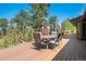 Expansive deck with outdoor seating and views of lush trees at 7845 Armadillo Trl, Evergreen, CO 80439