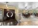 Grand foyer with decorative front doors, brick flooring, and formal dining area access at 7845 Armadillo Trl, Evergreen, CO 80439