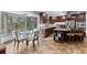 Modern kitchen with dark wood cabinets, granite countertops, and a breakfast nook with a view at 7845 Armadillo Trl, Evergreen, CO 80439