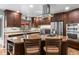 Kitchen with stainless steel appliances, beautiful cabinetry, and a large center island at 7845 Armadillo Trl, Evergreen, CO 80439