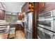 Well-equipped kitchen featuring stainless steel appliances and plenty of cabinet space at 7845 Armadillo Trl, Evergreen, CO 80439