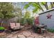 Inviting backyard with cozy seating area and stone pavers, perfect for outdoor relaxation and entertaining at 1343 Gay St, Longmont, CO 80501