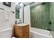 Chic bathroom with a stylish vanity, modern fixtures, and a bathtub with a shower at 1343 Gay St, Longmont, CO 80501