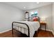 Comfortable bedroom with hardwood floors, natural light, and a cozy bed at 1343 Gay St, Longmont, CO 80501