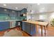 Stylish kitchen with blue cabinets, modern appliances, and an open layout at 1343 Gay St, Longmont, CO 80501