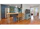 Modern kitchen featuring blue cabinets, stainless steel appliances, and a stylish island at 1343 Gay St, Longmont, CO 80501