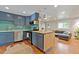 Stylish kitchen with blue cabinets, modern appliances, and an open layout at 1343 Gay St, Longmont, CO 80501