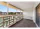 Private balcony overlooks a tree-lined area at 665 S Alton Way # 6D, Denver, CO 80247