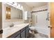 Bathroom with shower/tub, vanity, and updated fixtures at 665 S Alton Way # 6D, Denver, CO 80247