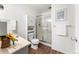 Clean bathroom with shower/tub combo, vanity, and linen storage at 665 S Alton Way # 6D, Denver, CO 80247