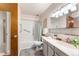 Clean bathroom with tub/shower combo, vanity with storage, and updated fixtures at 665 S Alton Way # 6D, Denver, CO 80247