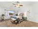 Spacious bedroom with carpet, large window, and ceiling fan at 665 S Alton Way # 6D, Denver, CO 80247