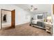 Bright bedroom with carpet, large window, and ceiling fan at 665 S Alton Way # 6D, Denver, CO 80247