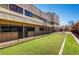 Outdoor bocce ball court with green turf at 665 S Alton Way # 6D, Denver, CO 80247