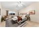 Spacious main bedroom with plush bedding, ample natural light, and a ceiling fan at 665 S Alton Way # 6D, Denver, CO 80247