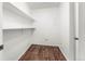 White storage room with wood flooring at 665 S Alton Way # 6D, Denver, CO 80247