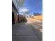 View of the alley and concrete driveway of this home at 661 Tennyson St, Denver, CO 80204