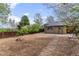 Backyard showcasing a partially fenced yard and mature trees on a sunny day at 661 Tennyson St, Denver, CO 80204