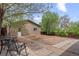 Spacious backyard featuring patio area and landscaping with a shed in the background at 661 Tennyson St, Denver, CO 80204