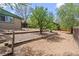 Backyard featuring a graveled area with trees and a garden at 661 Tennyson St, Denver, CO 80204