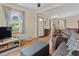 Bright living room with hardwood floors, a ceiling fan, and lots of natural light at 661 Tennyson St, Denver, CO 80204