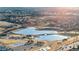 Scenic aerial view of community lake with walking paths, playground, and recreational areas at 4350 E 112Th Pl, Thornton, CO 80233